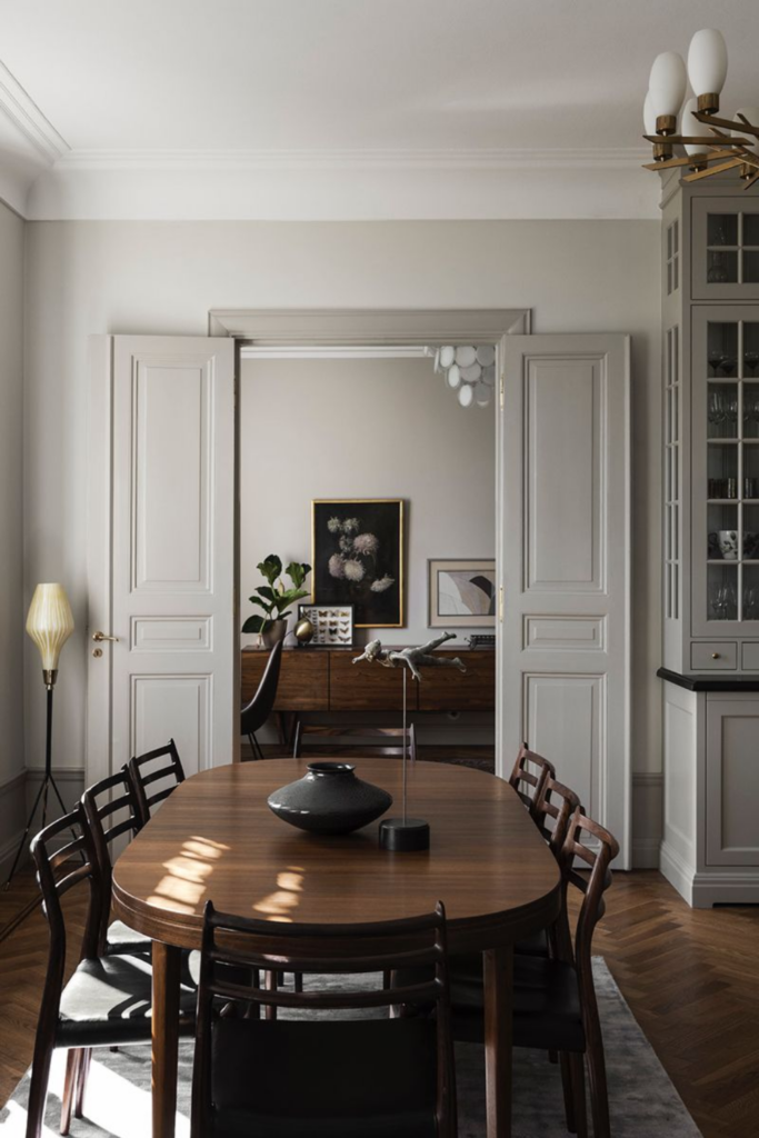 Vintage dining table and lighting creating a classic interior with modern pieces vintage and modern furniture mix in living room